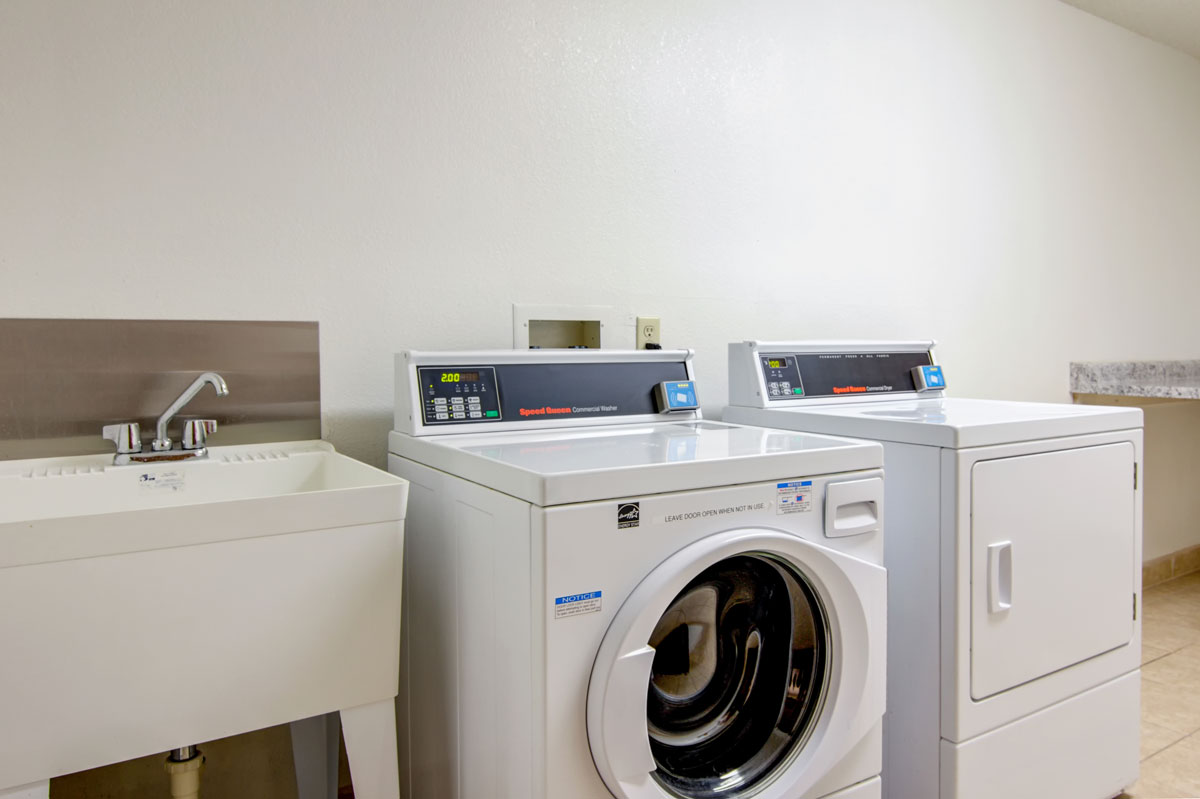 laundry room with front loading washer and dryer